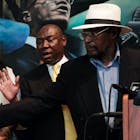 Mustafa Hassan, 84, an associate of Malcolm X, points to himself in a picture following the assassination of Malcolm X during a news conference with Civil rights attorney Ben Crump and and Malcolm X's daughter IIyasah Shabazz on July 25, 2023 in New York City. They allege more information has been discovered which they say points to efforts by the FBI to cover up a conspiracy to murder Malcolm X. Crump and his team said they were unveiling the information, including a new witness speaking for the first time, to show negligence or a possible cover up in the investigation of the famed civil rights leader. Mr. Hassan was at the scene of the assassination but was never interviewed by police. He allegedly heard police ask if a suspected gunman was "with us" after police witnessed Malcolm X's supporters beating him. Hassan said he saw another gunman, which he has stated in an affidavit.