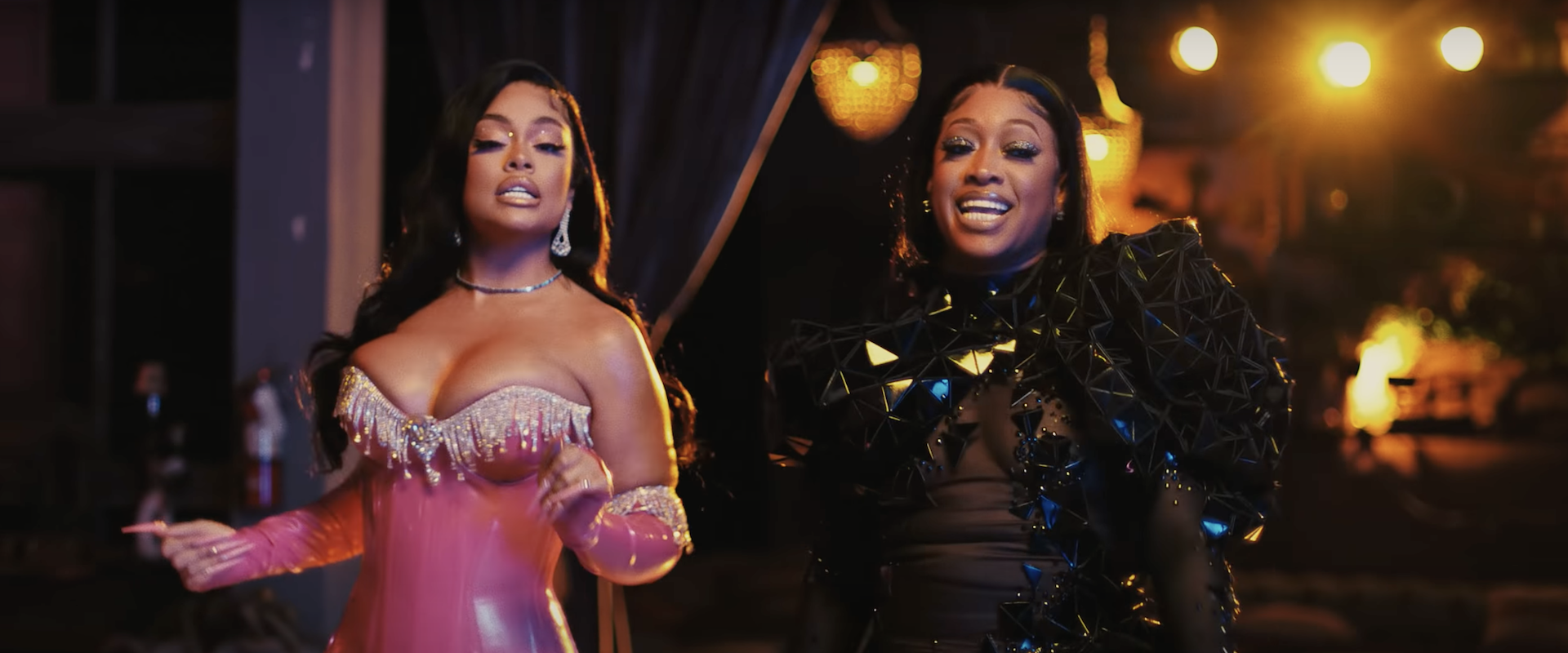 Rappers (L-R) LATTO and TRINA in a screenshot from the music video "Clap"