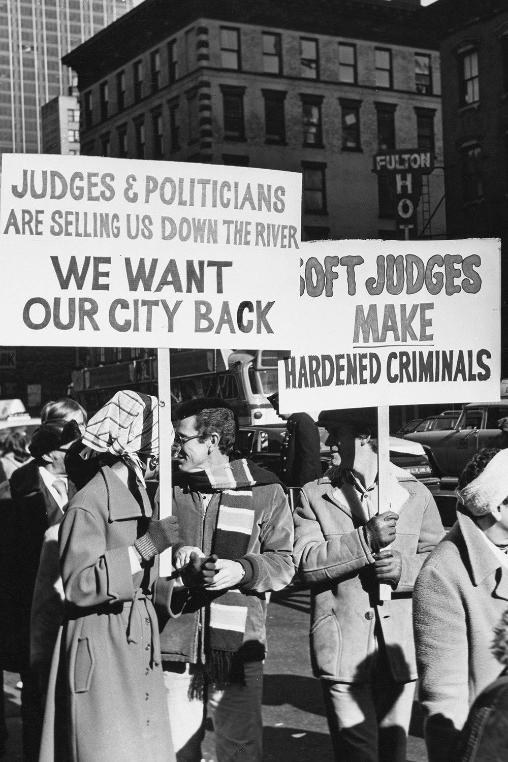 Protesters marching in the Times Square area demonstrating against the closure of entertainment and nightlife venues and the rise of illicit businesses, New York City, US, 1976. 