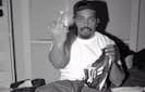 Sen Dog of Cypress Hill giving the middle finger