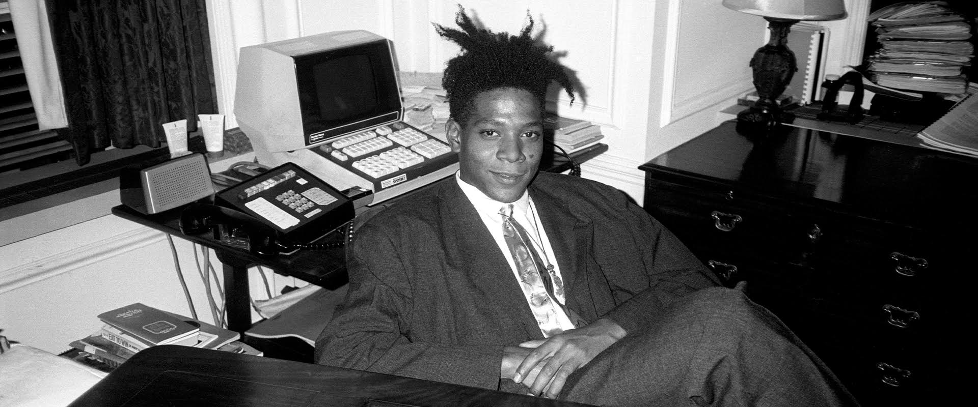 Jean - Michel Basquiat at the surprise birthday party for Susanne Bartsch at the Rainbow Roof, at Steven Greenberg's office, 30 Rockefeller Plaza. Thursday, September 19, 1985