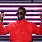 amika Mallory accepts the REVOLT Black Excellence award from host Sean ‘Diddy’ Combs on stage during the 2022 Billboard Music Awards held at the MGM Grand Garden Arena on May 15, 2022. -- (Photo by Rich Polk/NBCU Photo Bank via Getty Images)