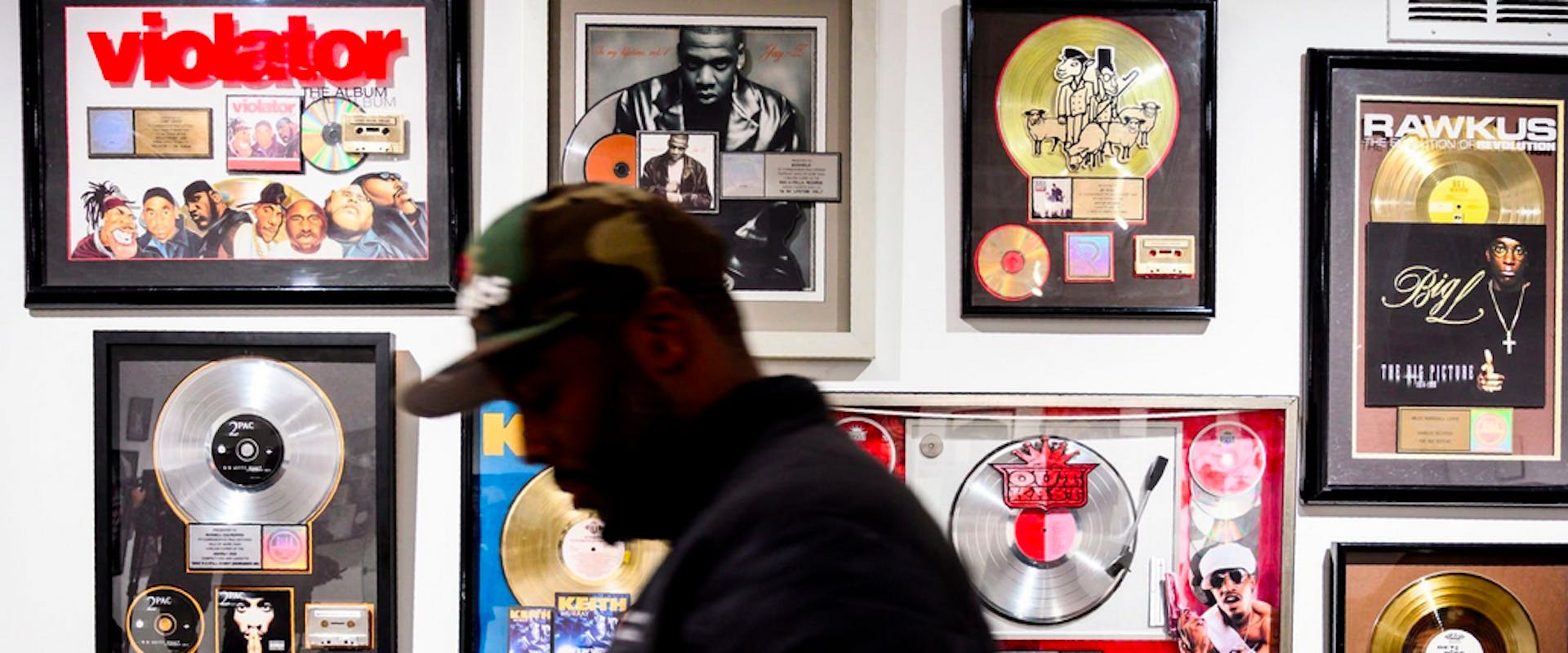 Guests look at memorabilia at the Hip-Hop Museum Pop Up Experience in Washington, DC on January 19, 2019. - The month long celebration of Hip-Hop began with live performances by the Sugarhill Gang, Melle Mel, and Grandmaster Caz, who were all signed to Sugarhill Records in the early 1980s. The interactive experience is expected to give fans an opportunity to understand how the music of urban culture has impacted the world.