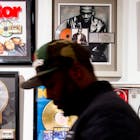 Guests look at memorabilia at the Hip-Hop Museum Pop Up Experience in Washington, DC on January 19, 2019. - The month long celebration of Hip-Hop began with live performances by the Sugarhill Gang, Melle Mel, and Grandmaster Caz, who were all signed to Sugarhill Records in the early 1980s. The interactive experience is expected to give fans an opportunity to understand how the music of urban culture has impacted the world.