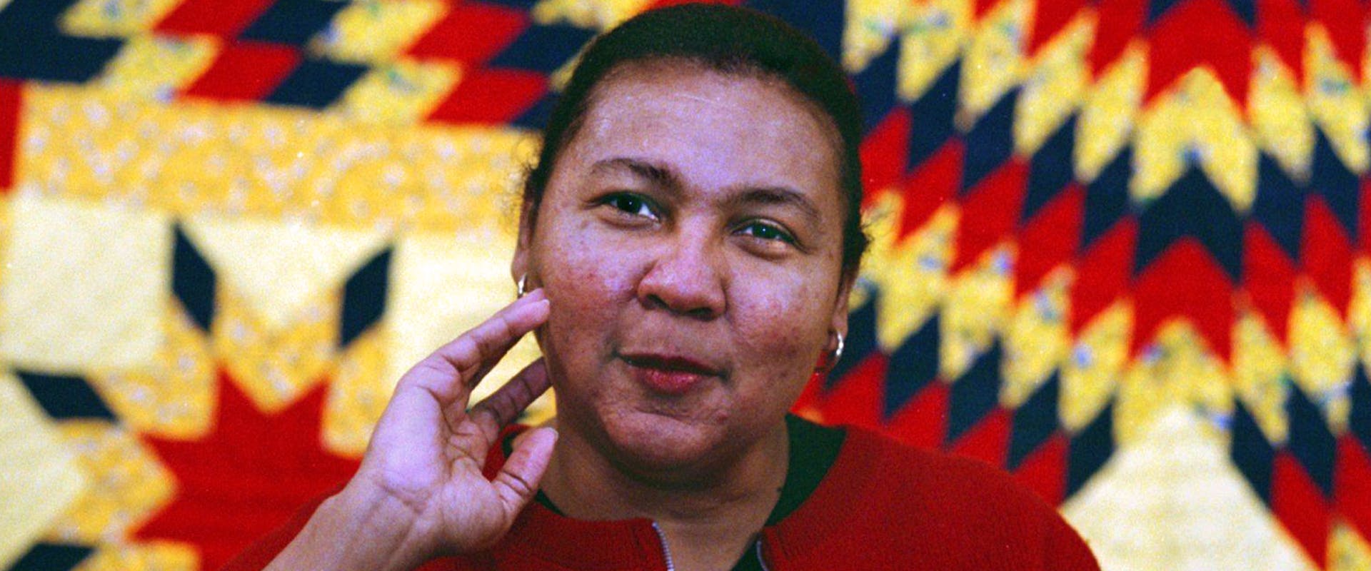 !999) Black feminist Bell Hooks during interview for her new book. Said the feminist writer who argues against all racial, class or gender stereotyping, 'Don't take my picture so close up. That's what White photographers do.' 