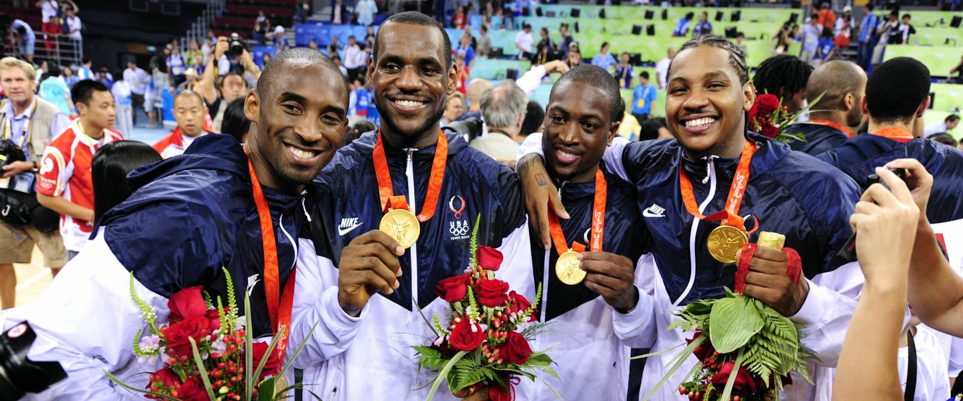 2008 Men's Olympic Basketball players (L-R) Kobe Bryant, Lebron James, Dwyane Wade, Carmelo Anthony pose with their gold medals at the 2008 Summer Olympic Games.