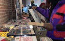 Attendees peruse the vinyl at Rock The Bells' Remember The Rhyme event in Atlanta
