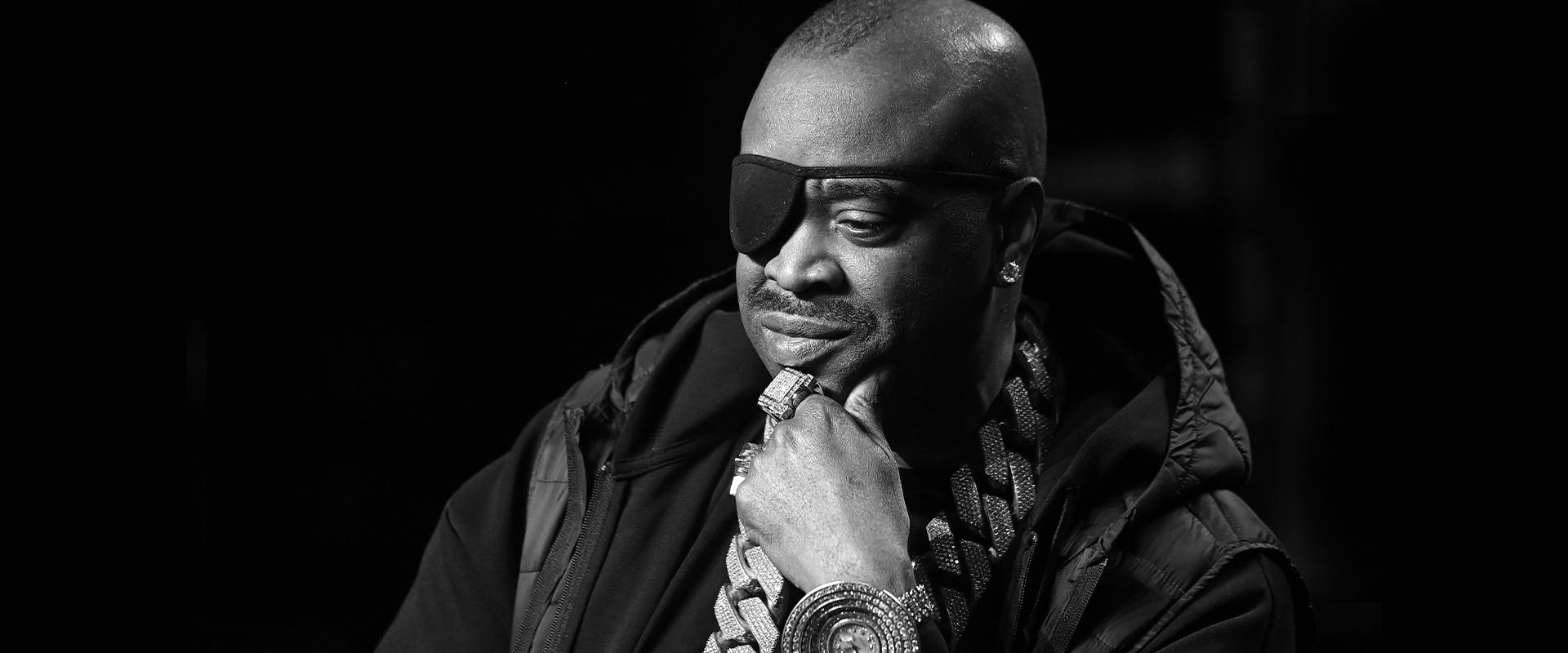 ATLANTA, GEORGIA - NOVEMBER 12: (EDITORS NOTE: Image has been converted to black and white.) Rapper Slick Rick onstage at the 2021 REVOLT Summit at 787 Windsor on November 12, 2021 in Atlanta, Georgia.