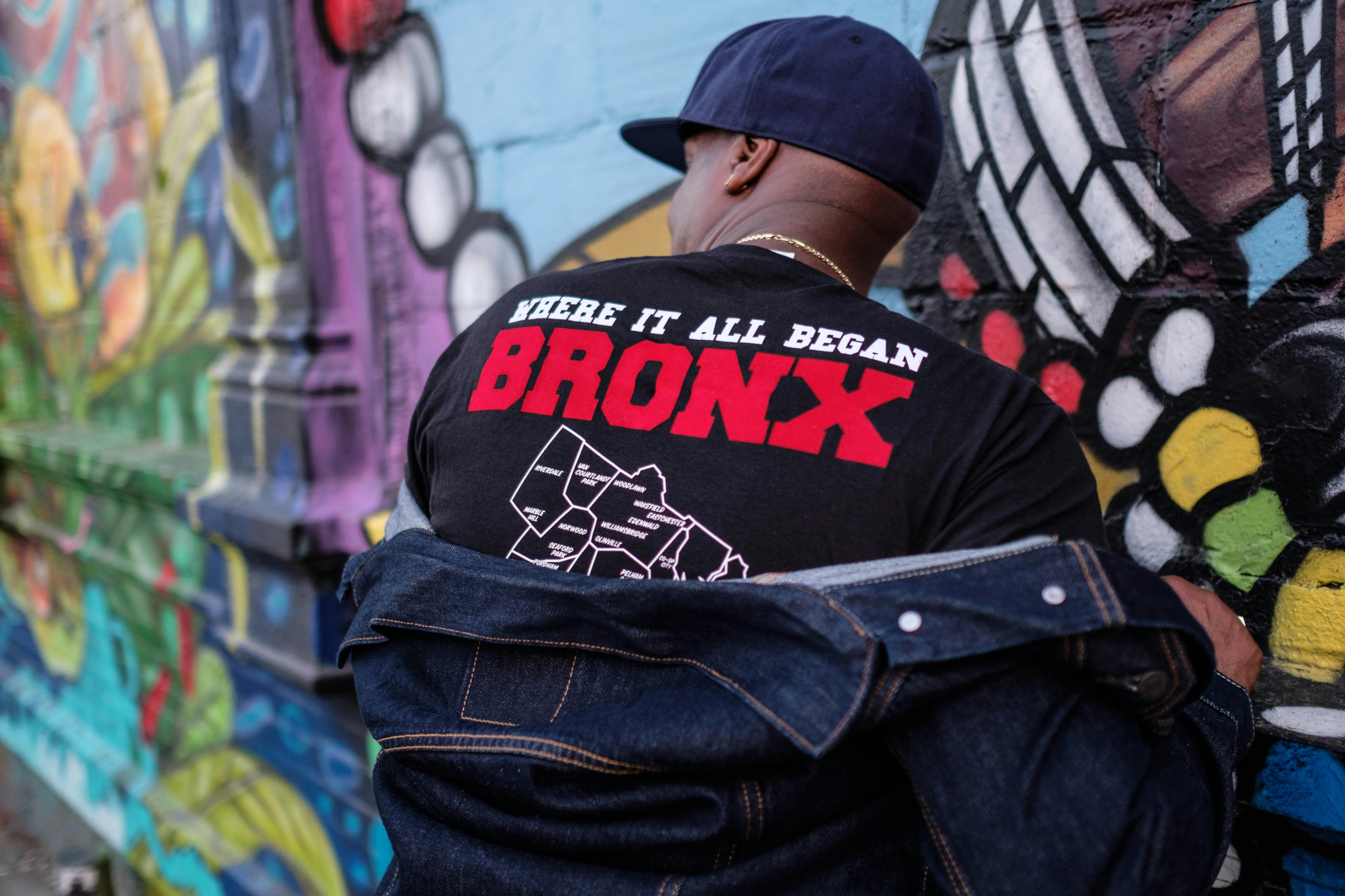 Grandmaster Flash poses with his back turned.