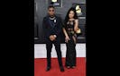Nas (L) and his daughter Destiny arrive for the 64th Annual Grammy Awards at the MGM Grand Garden Arena in Las Vegas on April 3, 2022. (Photo by ANGELA WEISS / AFP) (Photo by ANGELA WEISS/AFP via Getty Images)