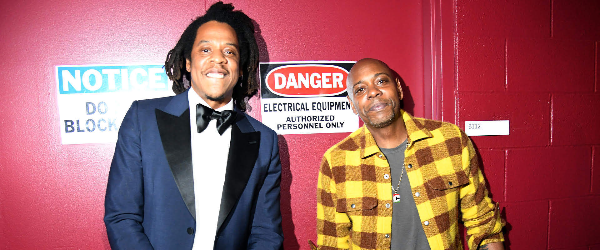 CLEVELAND, OHIO - OCTOBER 30: Jay-Z (L) and Dave Chappelle pose backstage during the 36th Annual Rock & Roll Hall Of Fame Induction Ceremony at Rocket Mortgage Fieldhouse on October 30, 2021 in Cleveland, Ohio