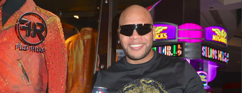 AS VEGAS, NV - JUNE 29: Rapper Flo Rida holds a can of Celsius Heat fitness drink during his memorabilia case dedication at the Hard Rock Hotel & Casino on June 29, 2018 in Las Vegas, Nevada. 