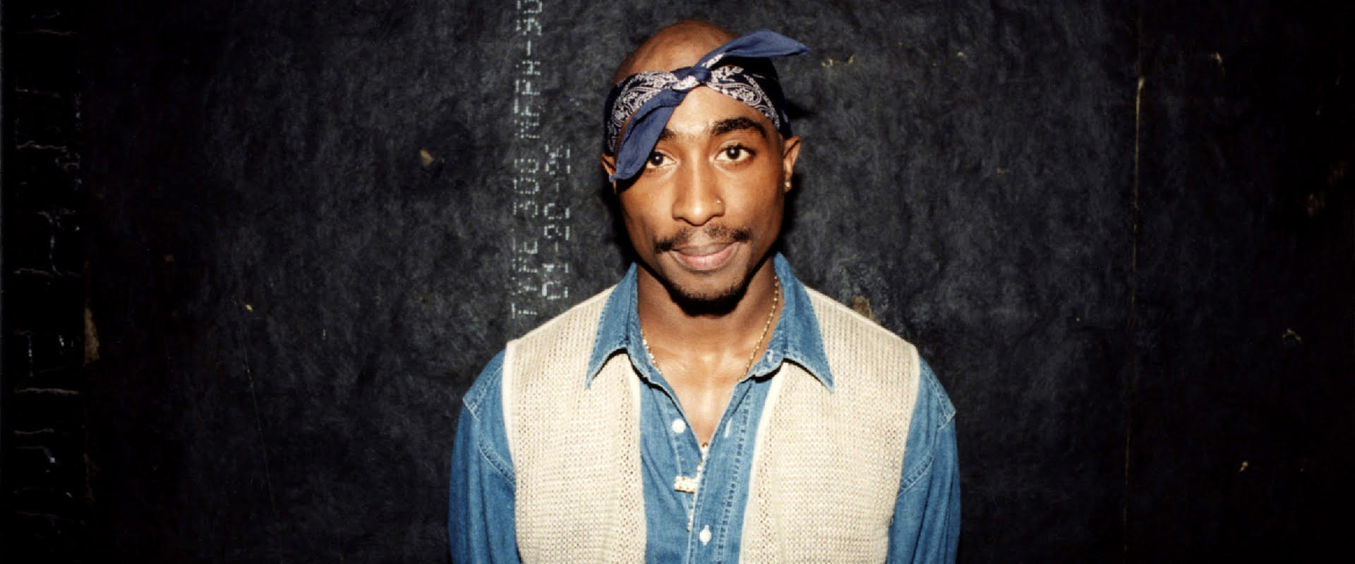 Rapper Tupac Shakur poses for photos backstage after his performance at the Regal Theater in Chicago, Illinois in March 1994