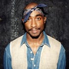 Rapper Tupac Shakur poses for photos backstage after his performance at the Regal Theater in Chicago, Illinois in March 1994
