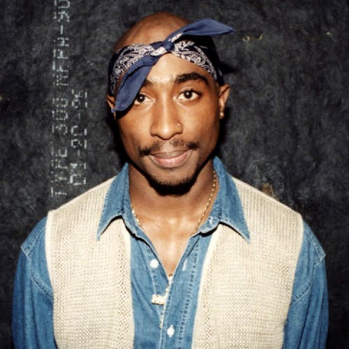 Rapper Tupac Shakur poses for photos backstage after his performance at the Regal Theater in Chicago, Illinois in March 1994