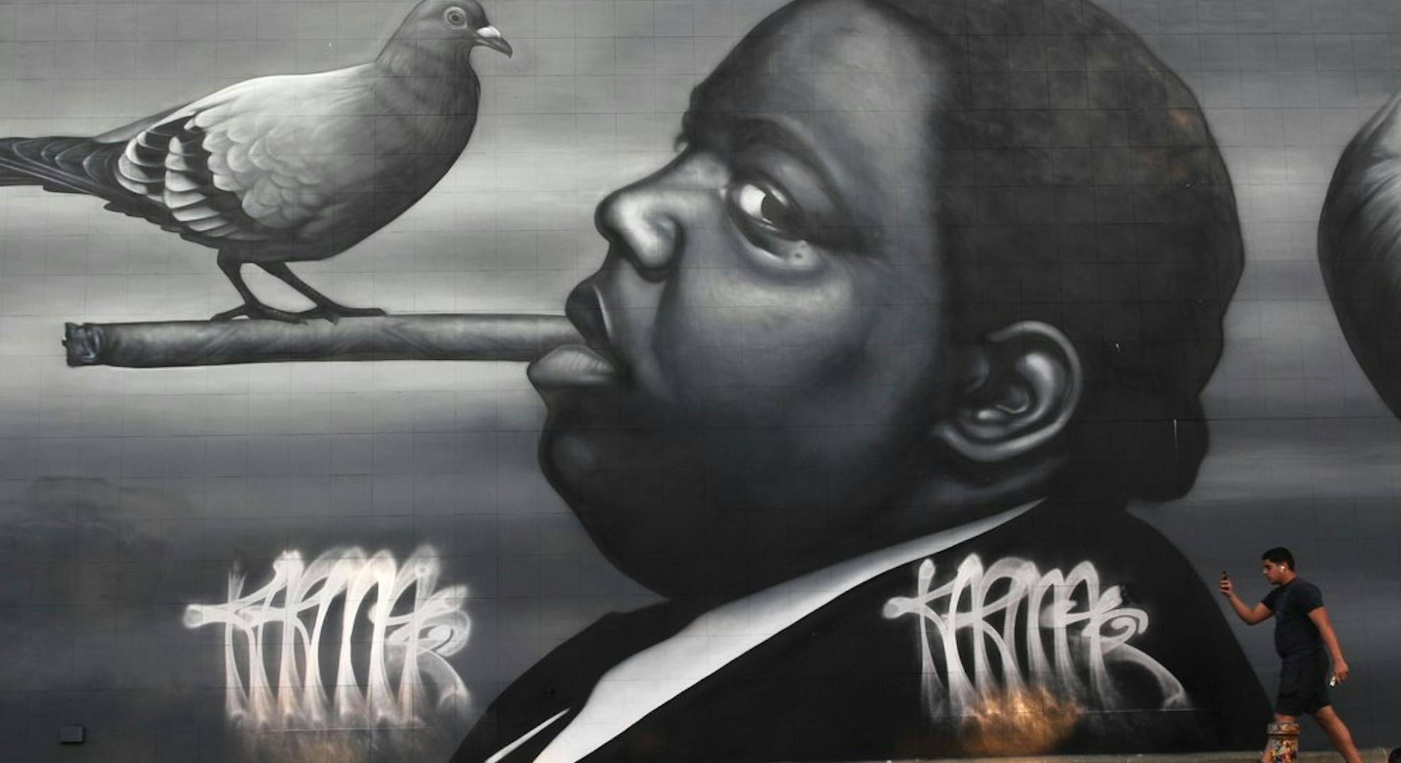 A mural of The Notorious BIG with a cigar by artist Owen Dippie