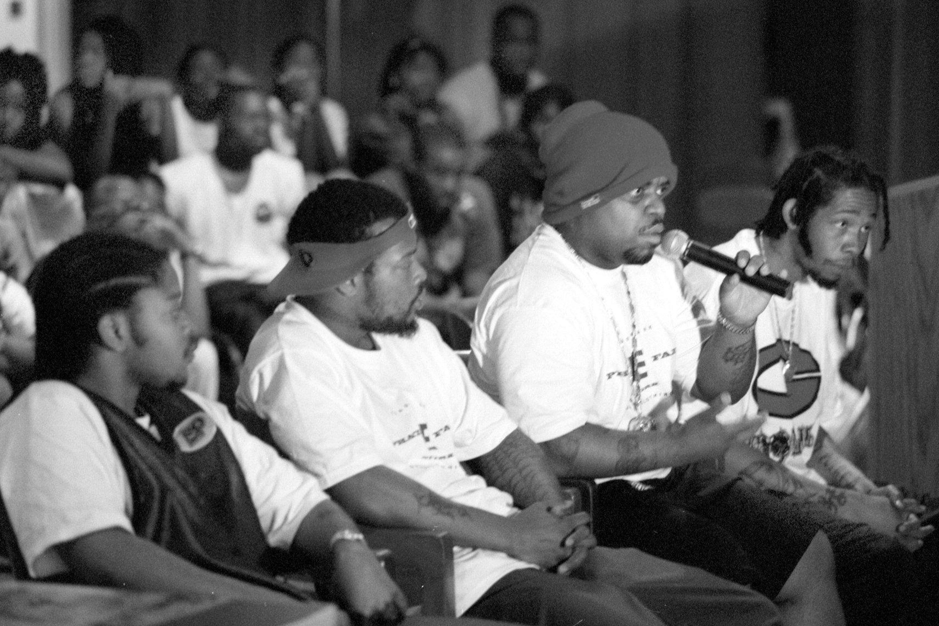 Goodie Mob hosted a workshop at H.D. Woodson Senior High School where they talked instead of performing. LTR members of Goodie Mob, T-Mo, Khujo, speaking is Cee-Lo, and far right is Big Gipp. (Photo by James M. Thresher/The The Washington Post via Getty Images)
