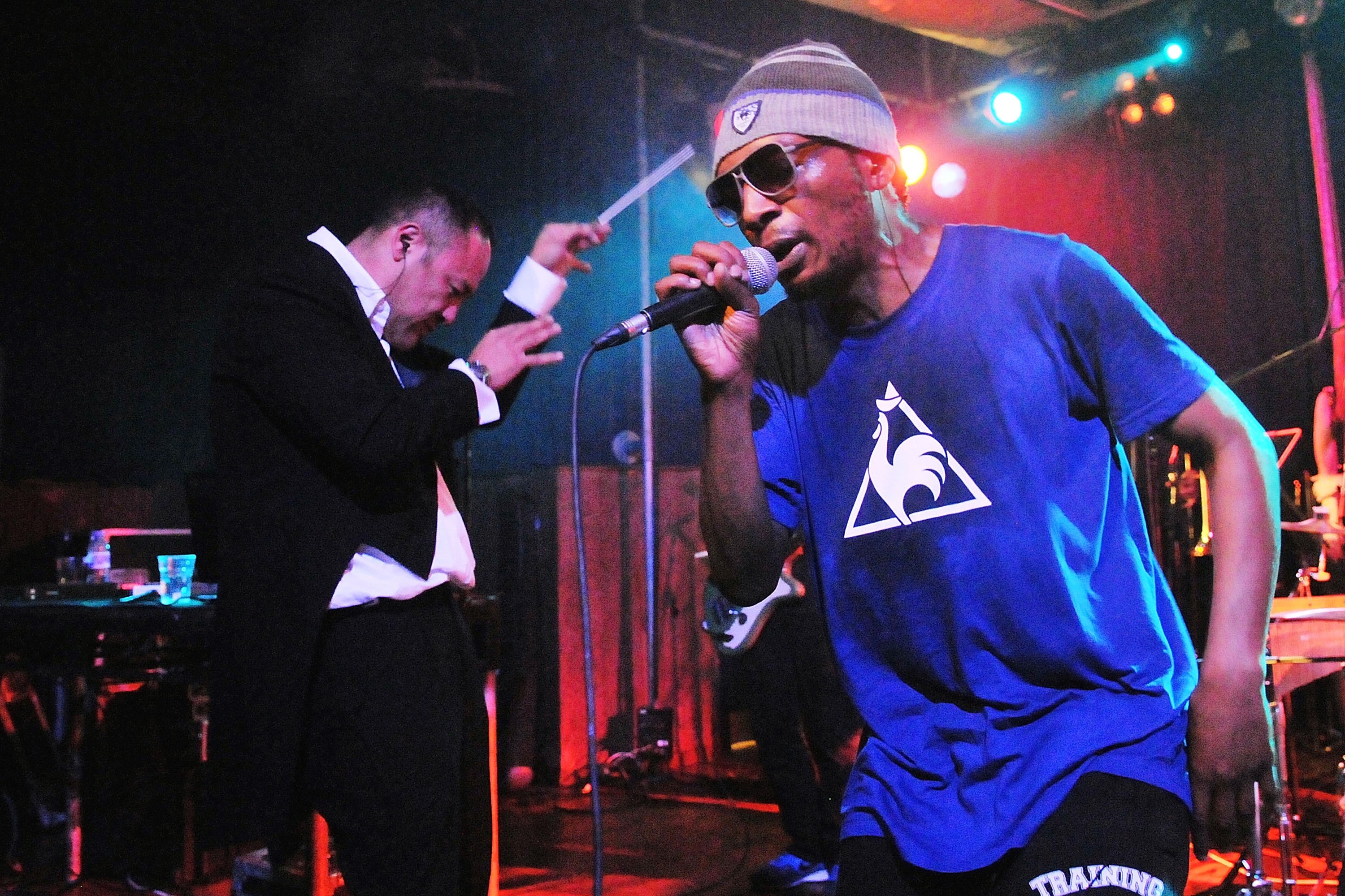 Producer Dan the Automator and rapper Del the Funky Homosapien of alternative hip hop supergroup Deltron 3030 perform live on stage with a 16-piece orchestra in support of their album 'Event 2', at the King's Cross Scala on December 12, 2013 in London, United Kingdom. (Photo by Jim Dyson/Redferns via Getty Images)