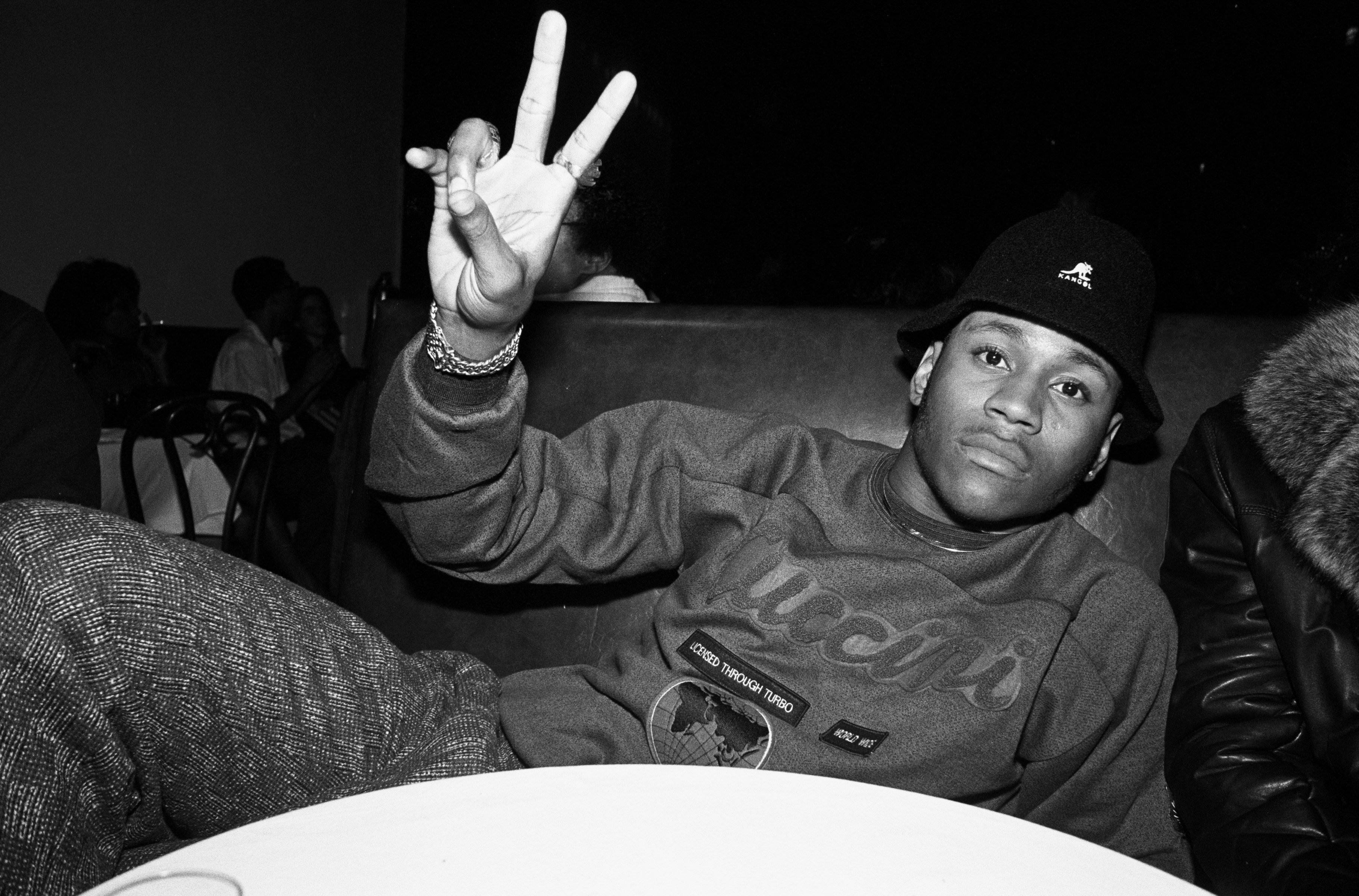 LL COOL J flashes a peace sign at a record release party for Run DMC's album 