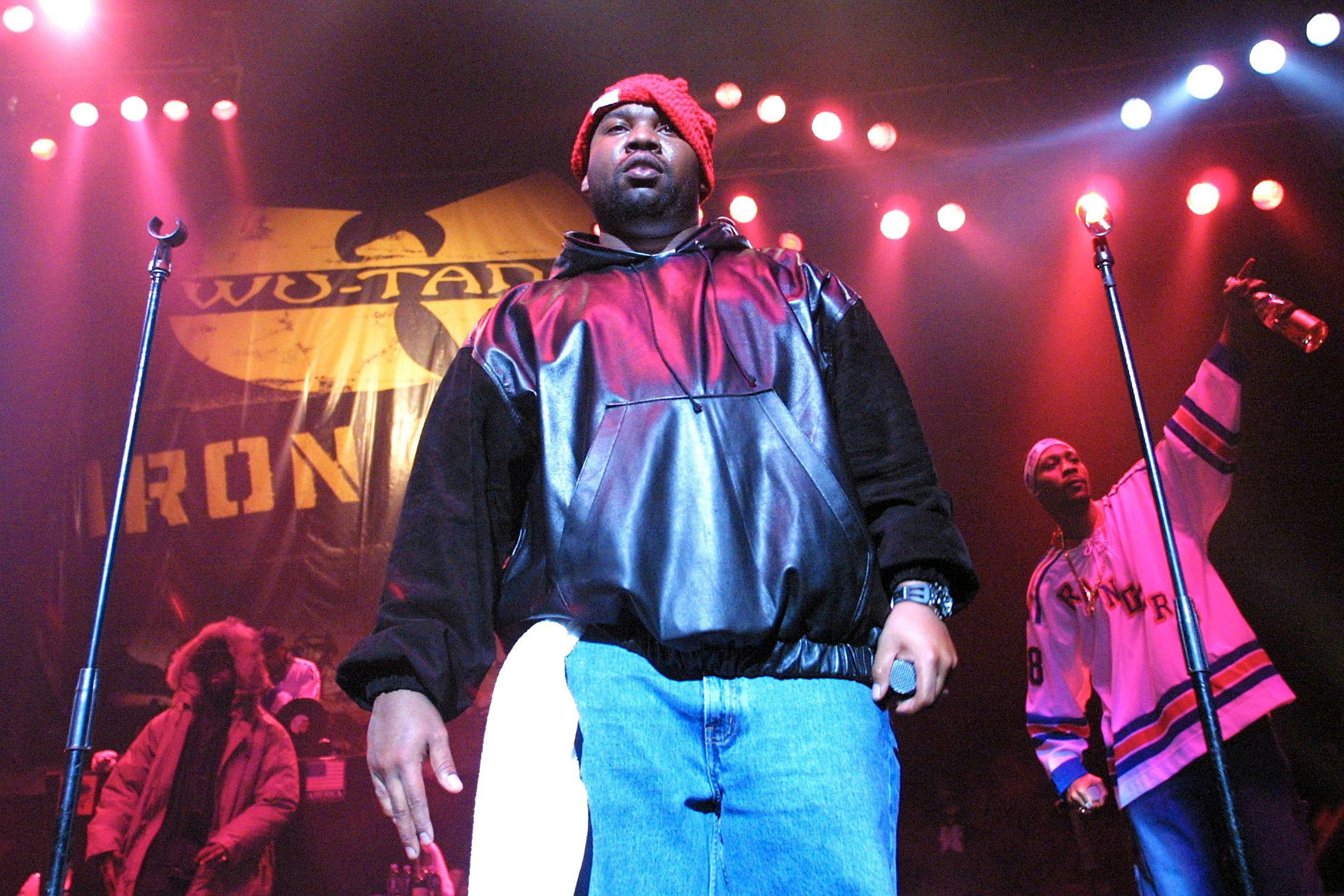 Raekwon, with RZA on back right, of the Wu-Tang Clan performs during a party to celebrate the release of their new album 