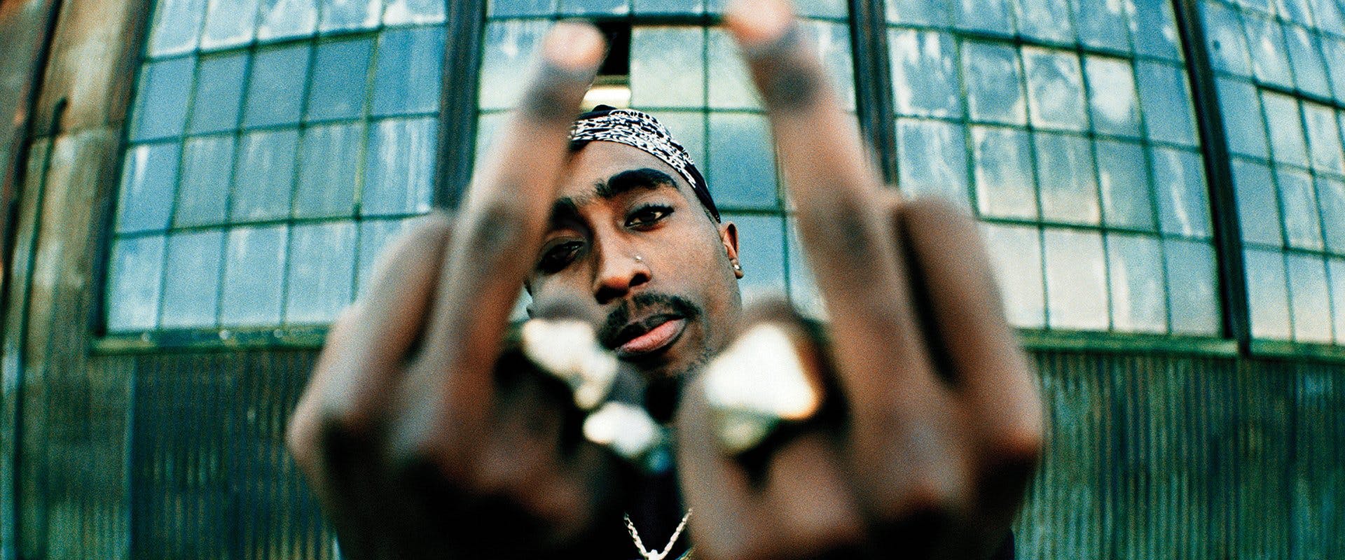 tupac middle finger cop