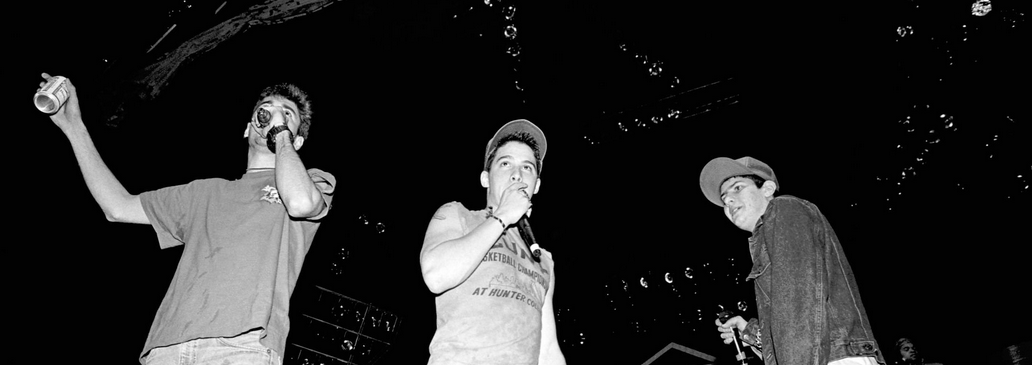 (L-R) American rapper, bass player and filmmaker Adam "MCA" Yauch (1964 - 2012) and rapper, guitarist and actor Adam "Ad-Rock" Horovitz and rapper, musician, and music producer Michael "Mike D" Diamond, of the American rap rock group Beastie Boys, sing on stage during the 1987 Licensed to Ill tour at the Centrum in Worcester in Worcester, Massachusetts on April 9, 1987. 