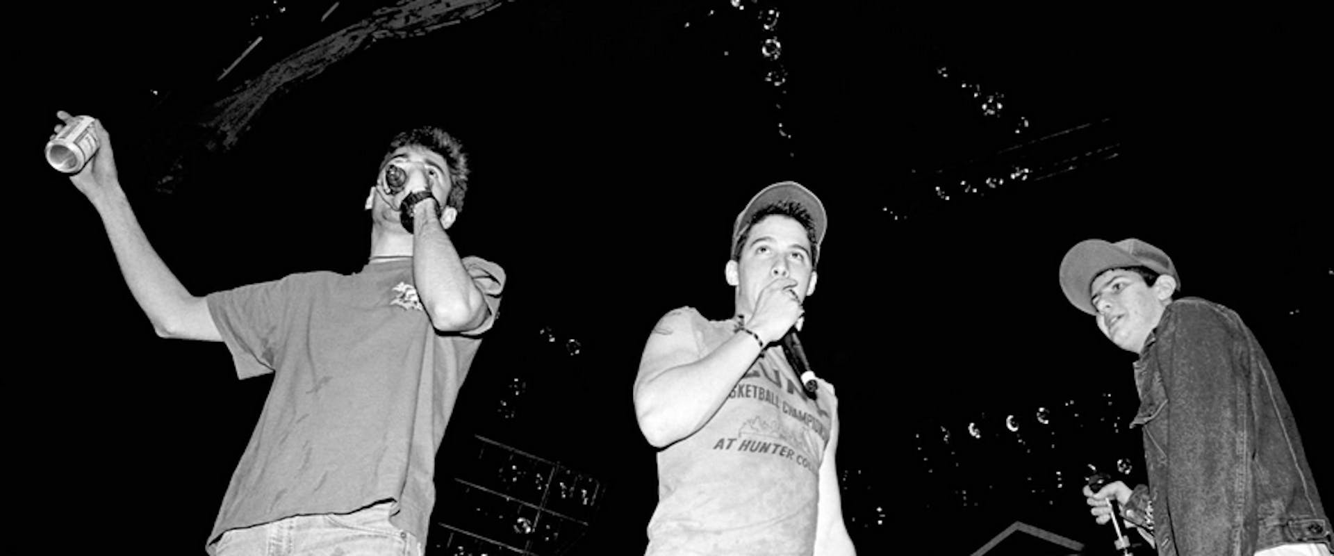 (L-R) American rapper, bass player and filmmaker Adam "MCA" Yauch (1964 - 2012) and rapper, guitarist and actor Adam "Ad-Rock" Horovitz and rapper, musician, and music producer Michael "Mike D" Diamond, of the American rap rock group Beastie Boys, sing on stage during the 1987 Licensed to Ill tour at the Centrum in Worcester in Worcester, Massachusetts on April 9, 1987. 