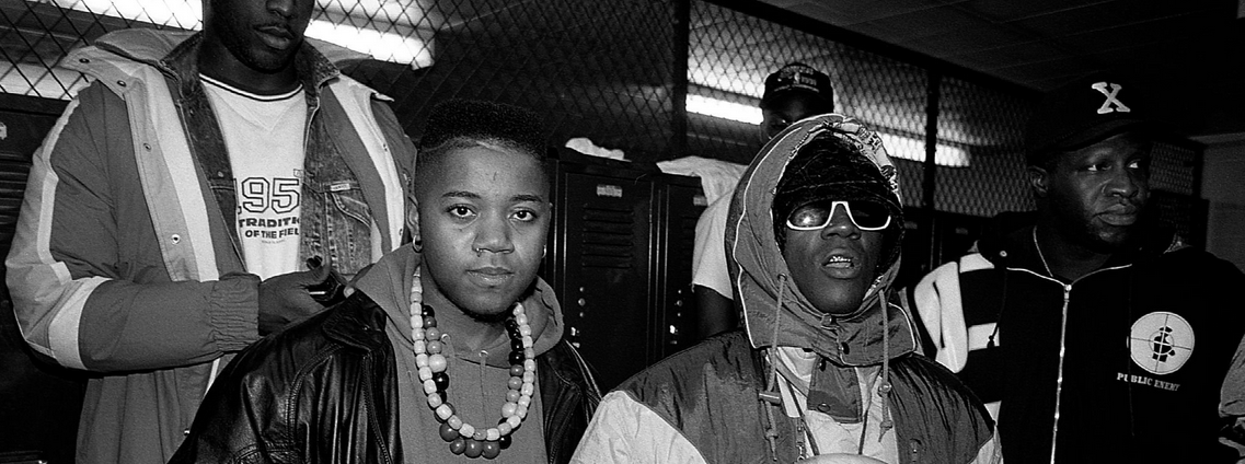 CHICAGO - NOVEMBER 1991: Rappers Tung Twista (Carl Terrell Mitchell) and Flavor Flav (William J. Drayton, Jr.) of Public Enemy poses for photos after participating in a celebrity basketball game at Malcolm X College in Chicago, Illinois in November 1991. 