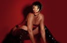 Adina Howard poses in black leather boots