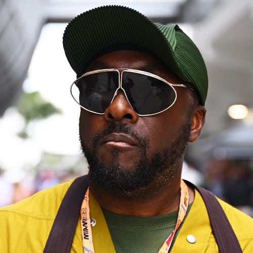 MIAMI, FLORIDA - MAY 08: Will.I.Am walks in the Paddock prior to the F1 Grand Prix of Miami at the Miami International Autodrome on May 08, 2022 in Miami, Florida