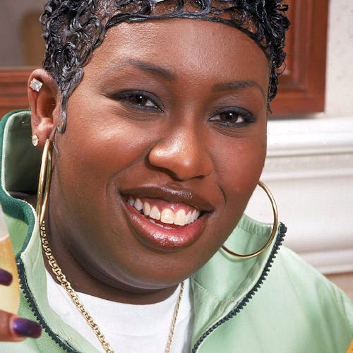 Missy ELLIOTT; posed, holding glass and bottle of champagne (Photo by Mick Hutson/Redferns)