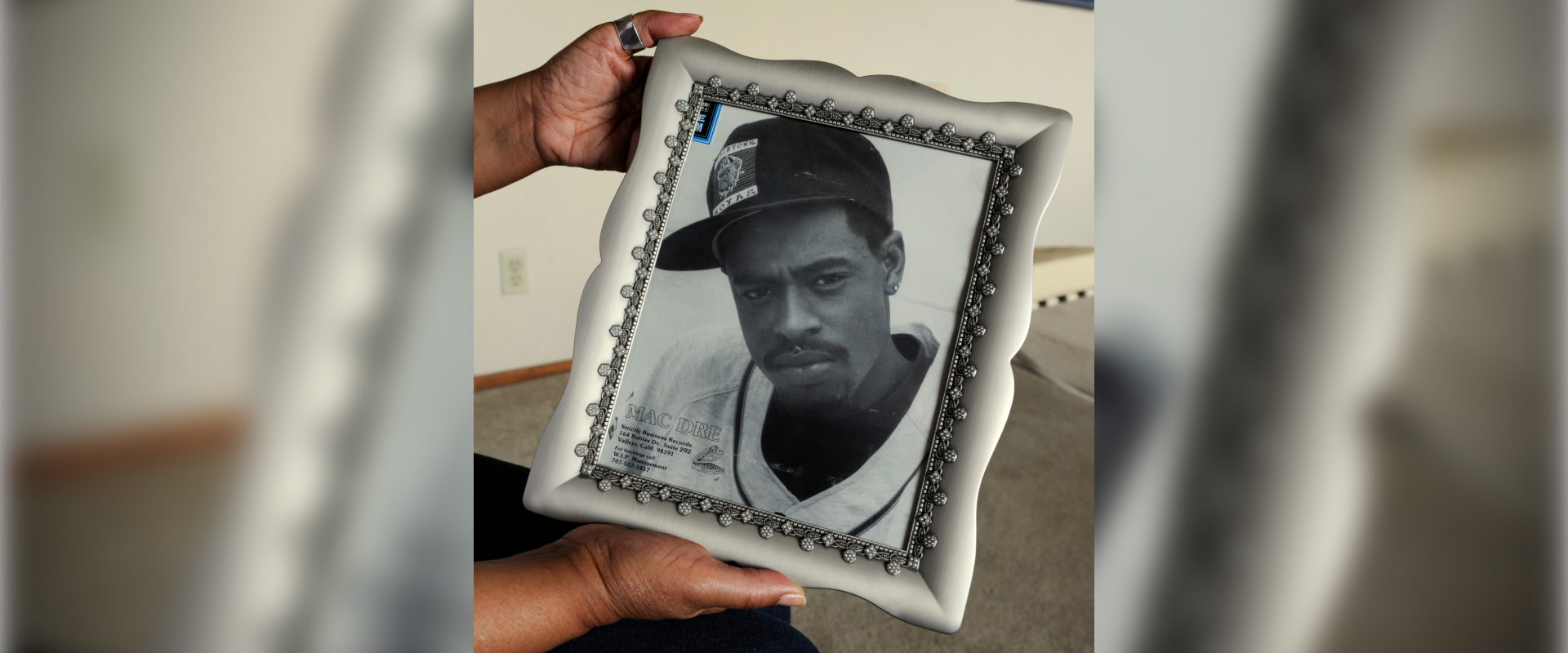 VALLEJO, CALIFORNIA - APRIL 25: Wanda Salvatto, mother of legendary rapper Mac Dre who was killed in 2004, holds a framed photograph of her son when he was in his late teens at her home in Vallejo, California on April 25, 2012. (Photo by Susan Tripp Pollard/MediaNews Group/East Bay Times via Getty Images)