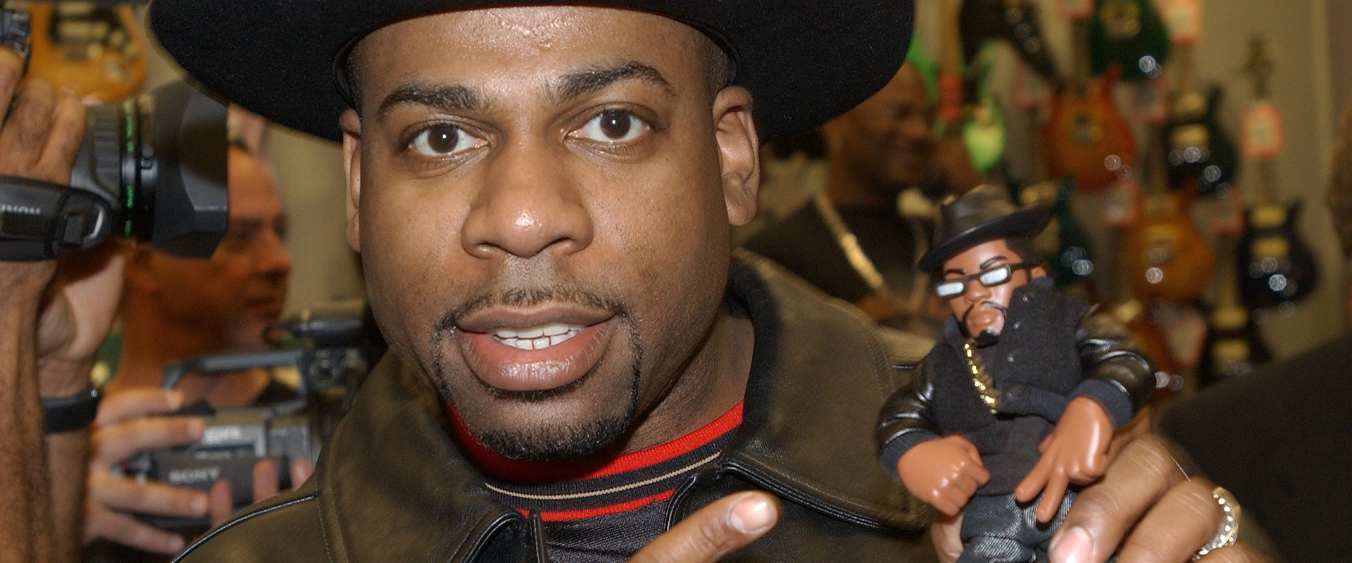 Jason "Jam Master Jay" Mizell holds a toy figure of himself at a ceremony honoring hip-hop group RUN-DMC's induction into the Hollywood RockWalk February 25, 2002 at the Guitar Center in Hollywood, California. (Photo by Vince Bucci/Getty Images)

