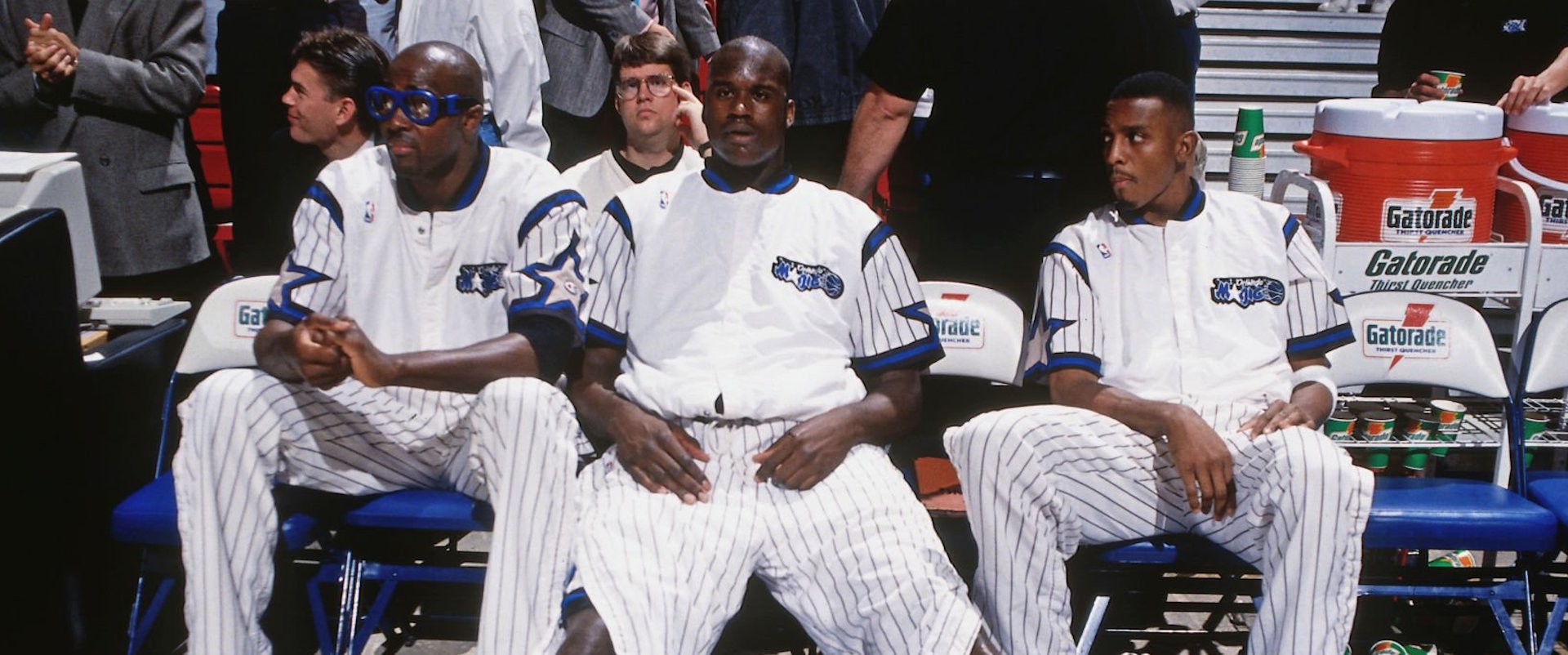 Horace Grant #54, Shaquille O'Neal #32 and Anfernee Hardaway #1 of the Orlando Magic looks on against the Denver Nuggets on December 14, 1994 at the Orlando Arena in Orlando, Florida. 