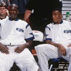 Horace Grant #54, Shaquille O'Neal #32 and Anfernee Hardaway #1 of the Orlando Magic looks on against the Denver Nuggets on December 14, 1994 at the Orlando Arena in Orlando, Florida. 