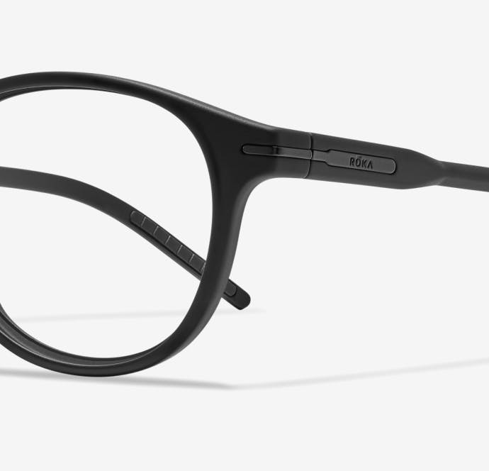 Angled to left view of round, matte black Oslo eyeglasses