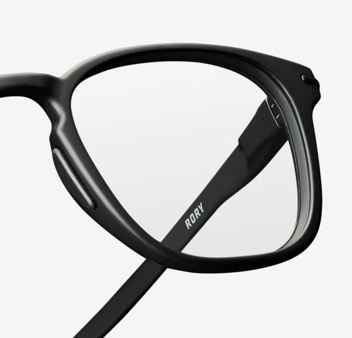 Angled view of rectangular, matte black Rory eyeglasses