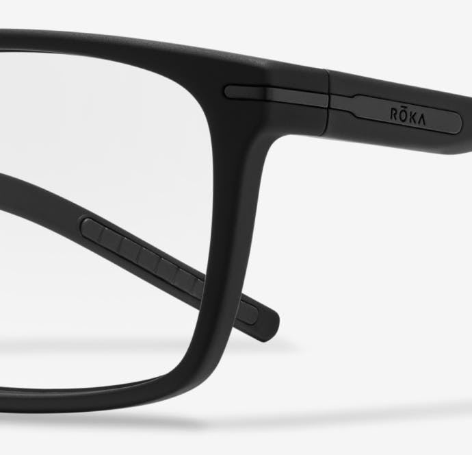 Angled view of sharp rectangular, matte black Palmer eyeglasses