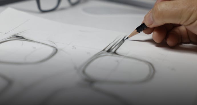 Person sketching eyewear