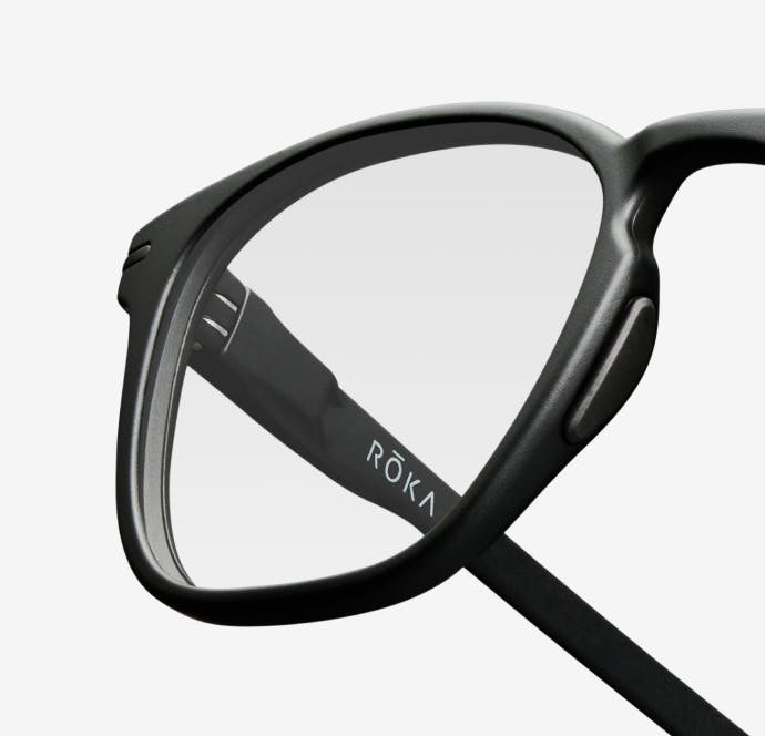 Angular view of rectangular, matte black Cade eyeglasses