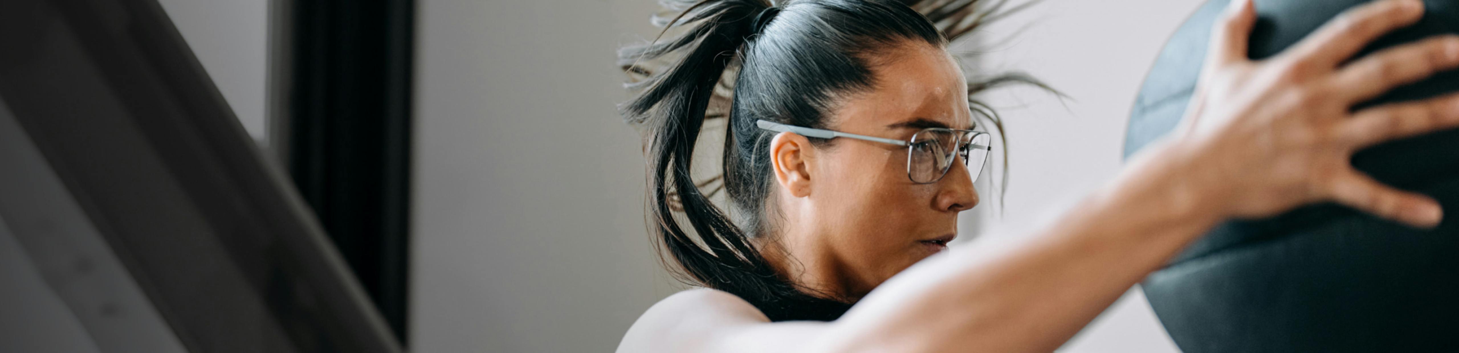 Woman training with medicine ball