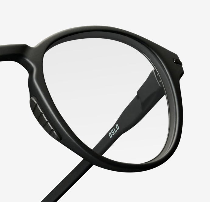 Angled upward view of round, matte black Oslo eyeglasses