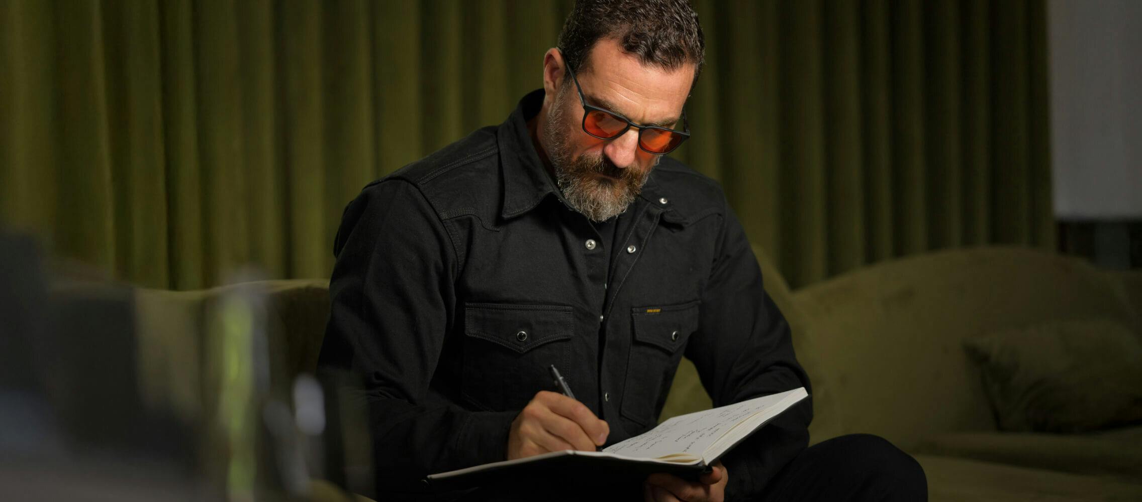 Huberman writing in notebook
