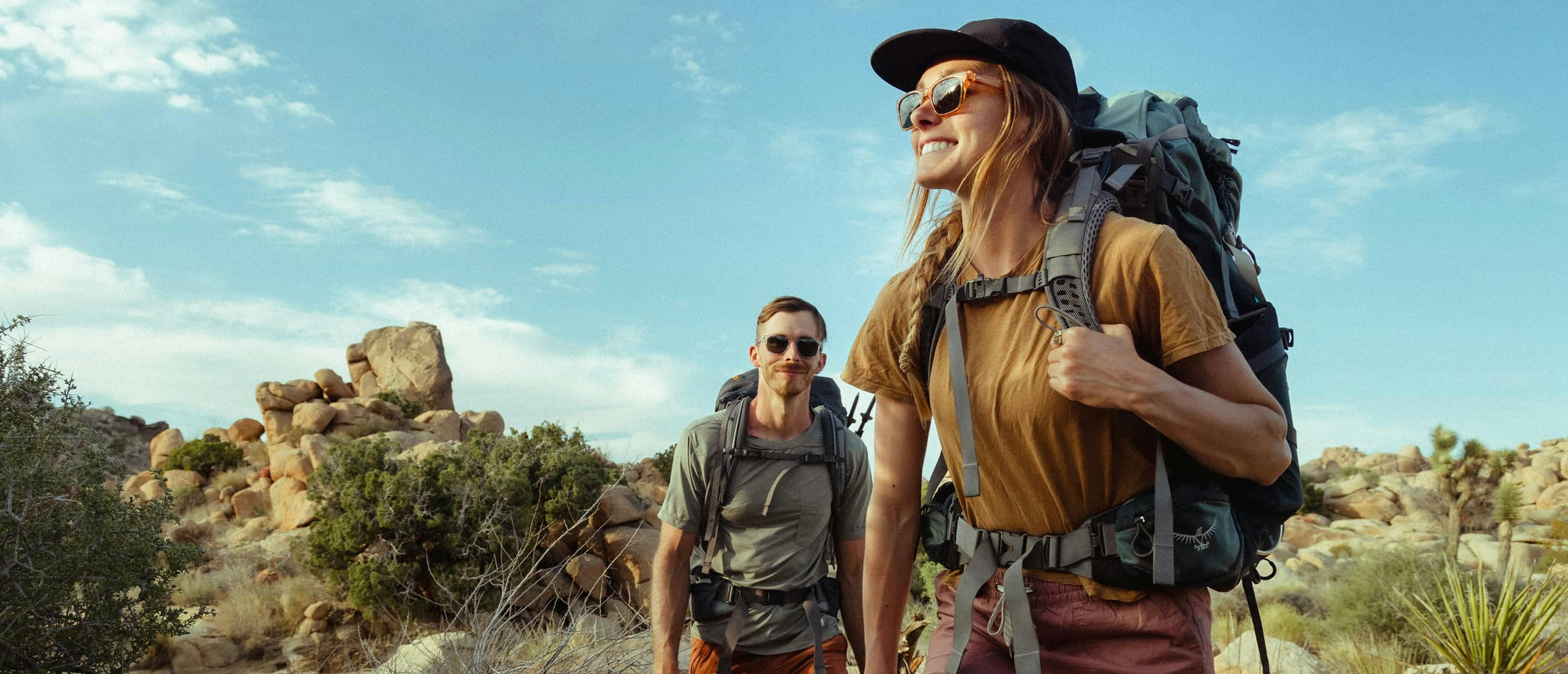 Woman and man hiking wearing Lockhart sunglasses