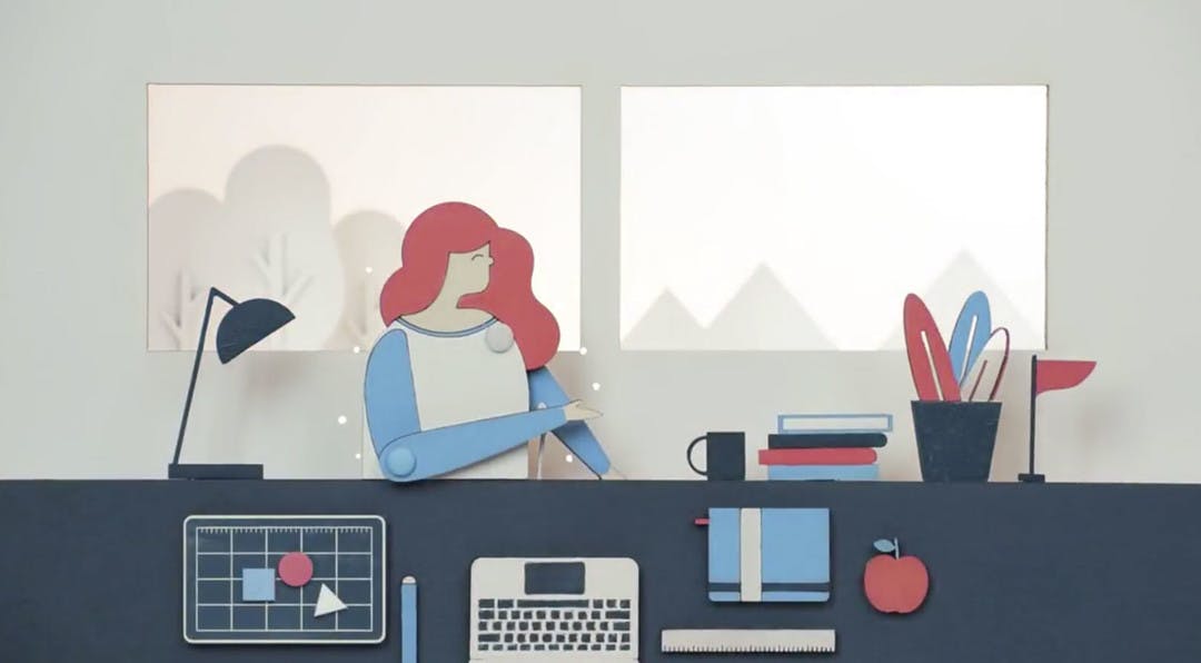 illustration of a women at her desk with laptop, files and office supplies