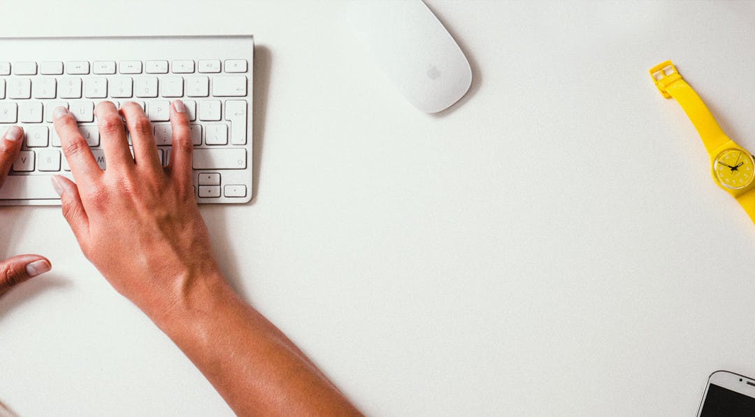 person typing on a keyboard