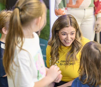 CFFC staff smiling with children.