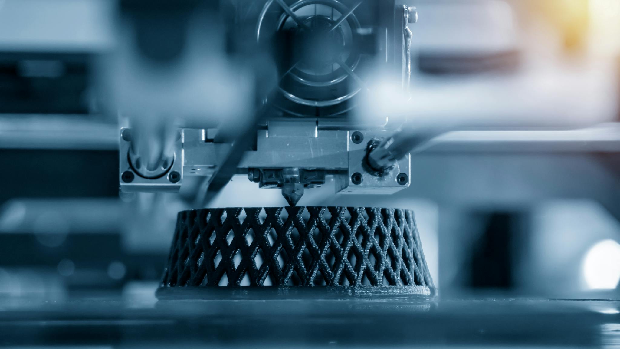 3D printer producing a lattice-structured object for advanced manufacturing applications.