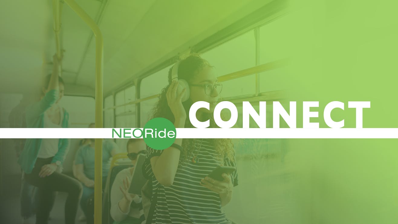 Passengers on a public bus with "NEORide CONNECT one person wears headphones and holds a smartphone.