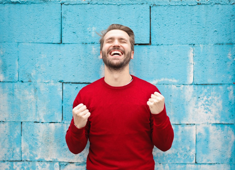 Happy man in a red shirt